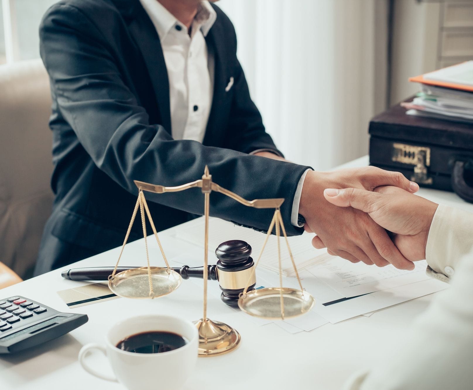 Businessman Shaking Hands To Seal A Deal With His Partner Lawyer