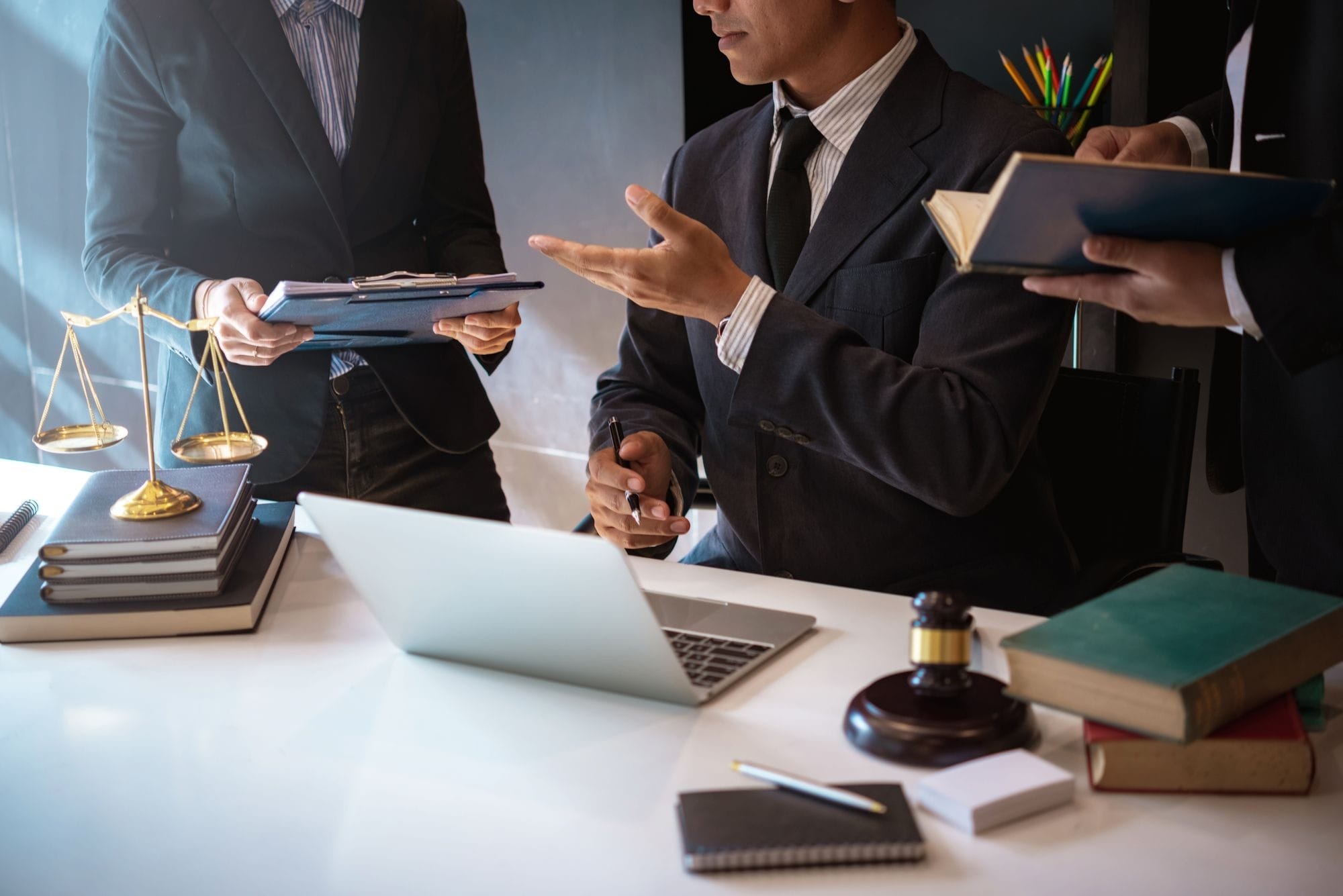 Lawyers Having Team Meeting With Law Documents